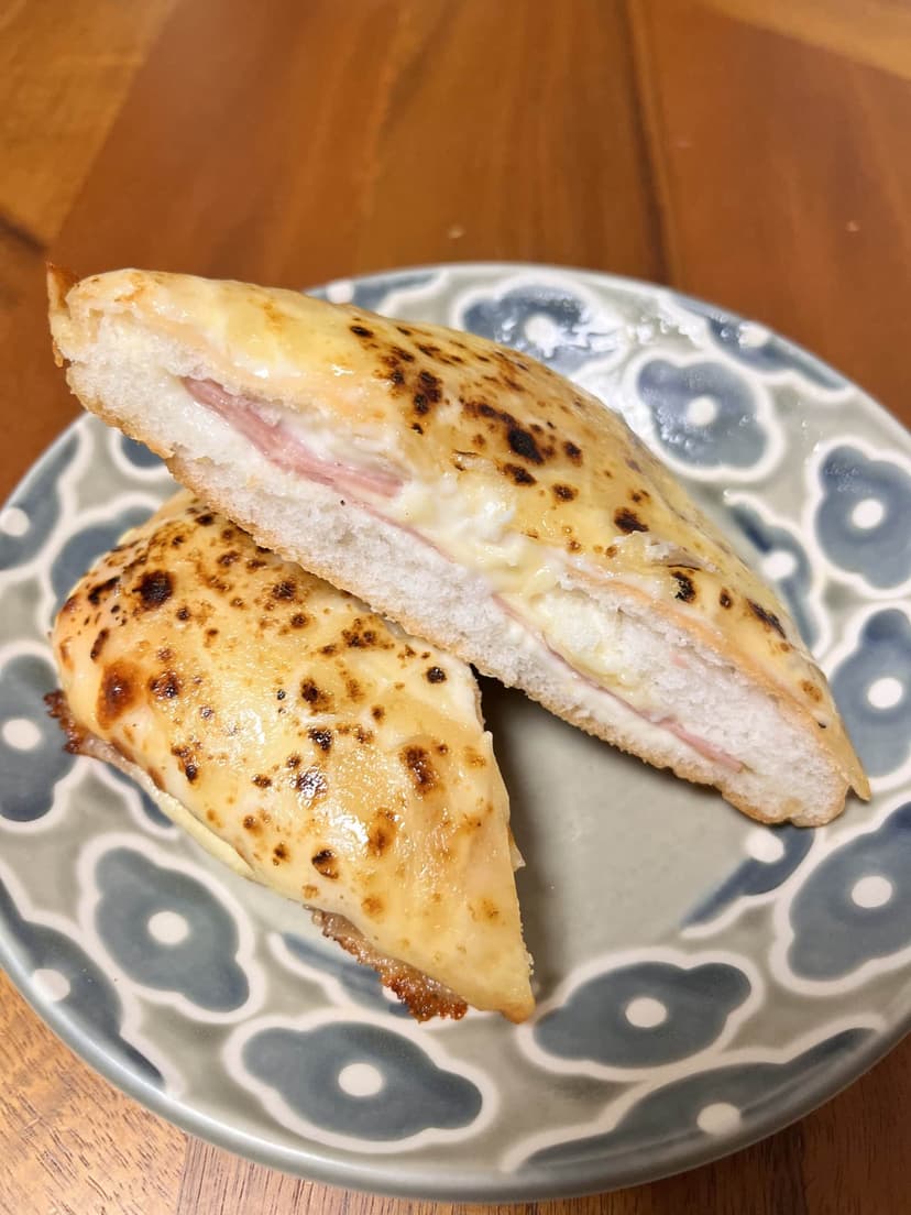 The croque monsieur, cut in half on the plate