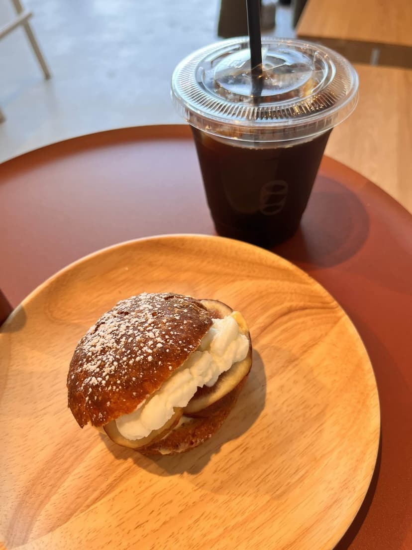the seasonal fruit sandwich cut open, fruit and cream visible