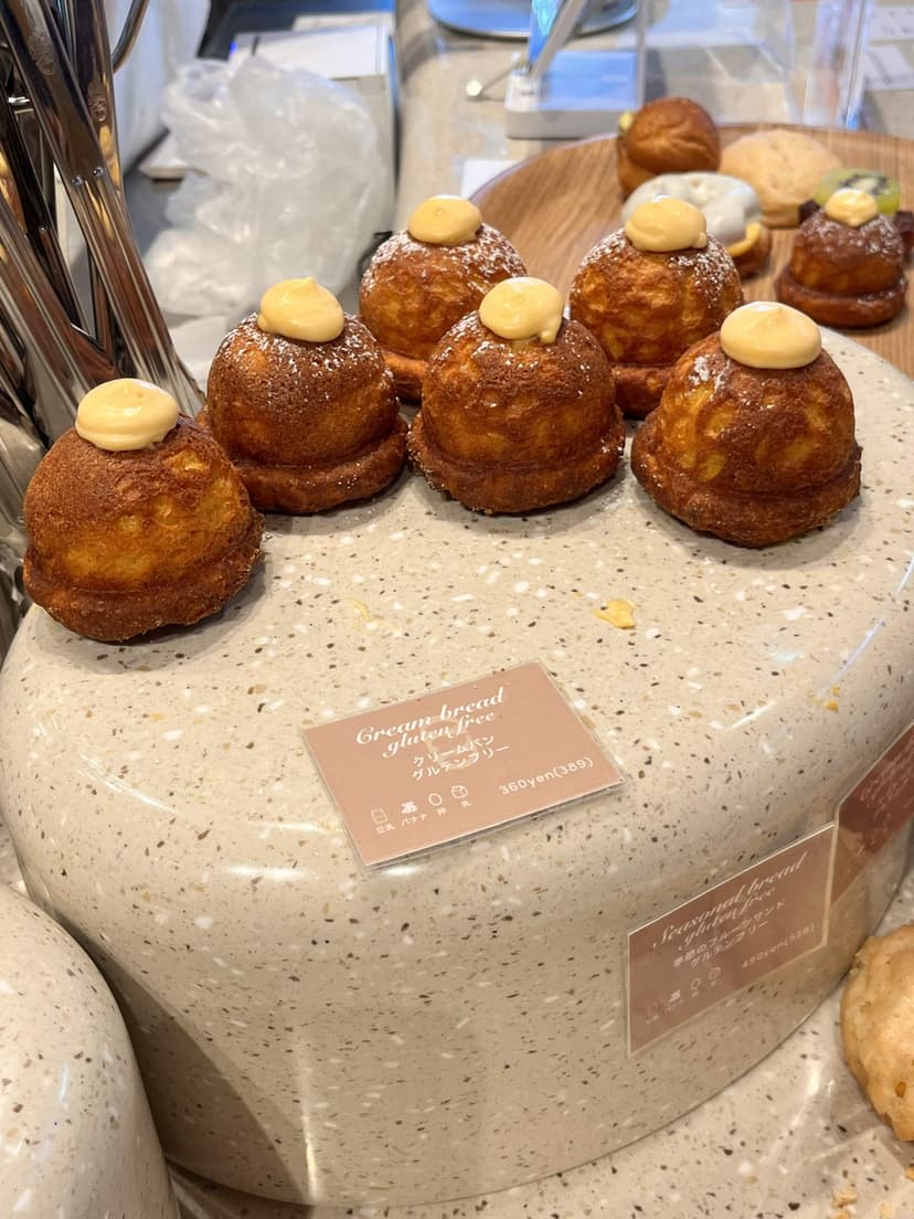 A row of the cream-topped buns on the counter