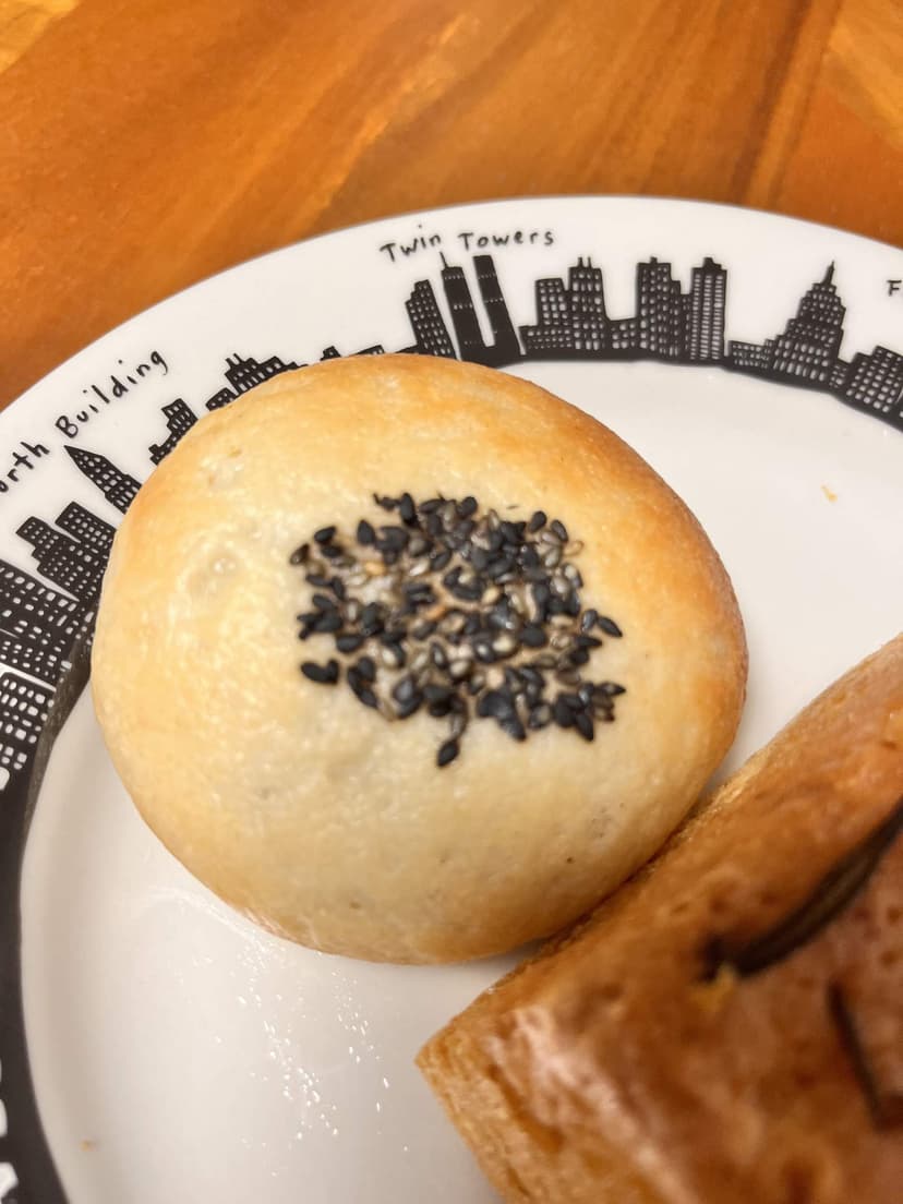 The anpan: a soft bun topped with black sesame seeds