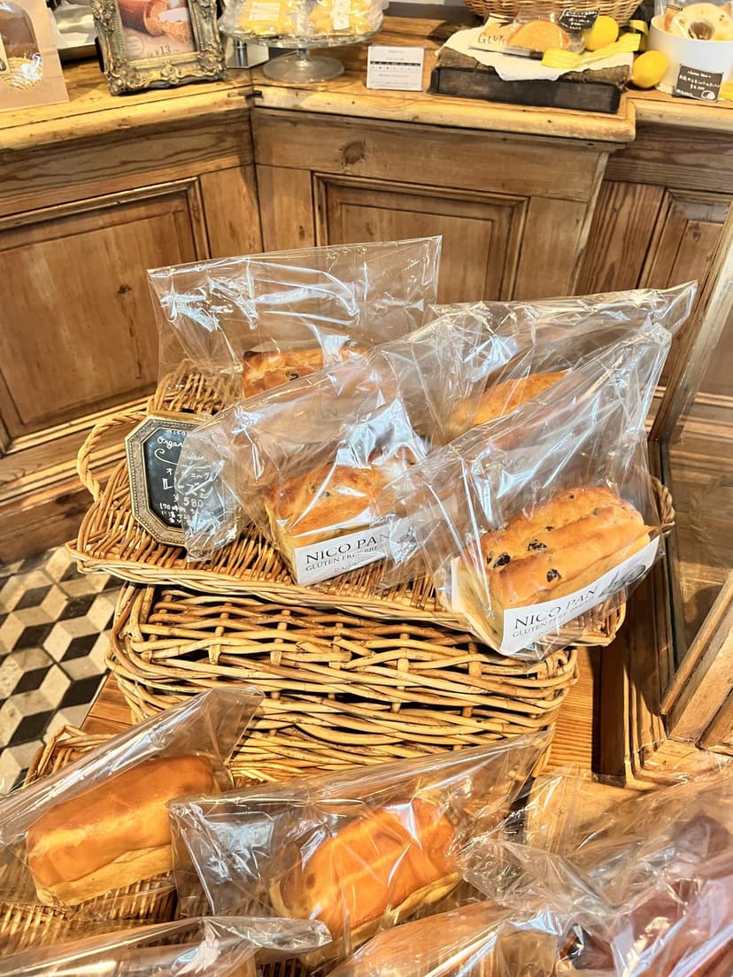 The shelves of packaged bread, baked in the shop that morning